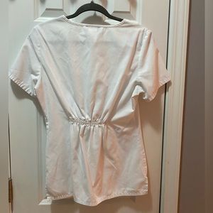 White scrub top